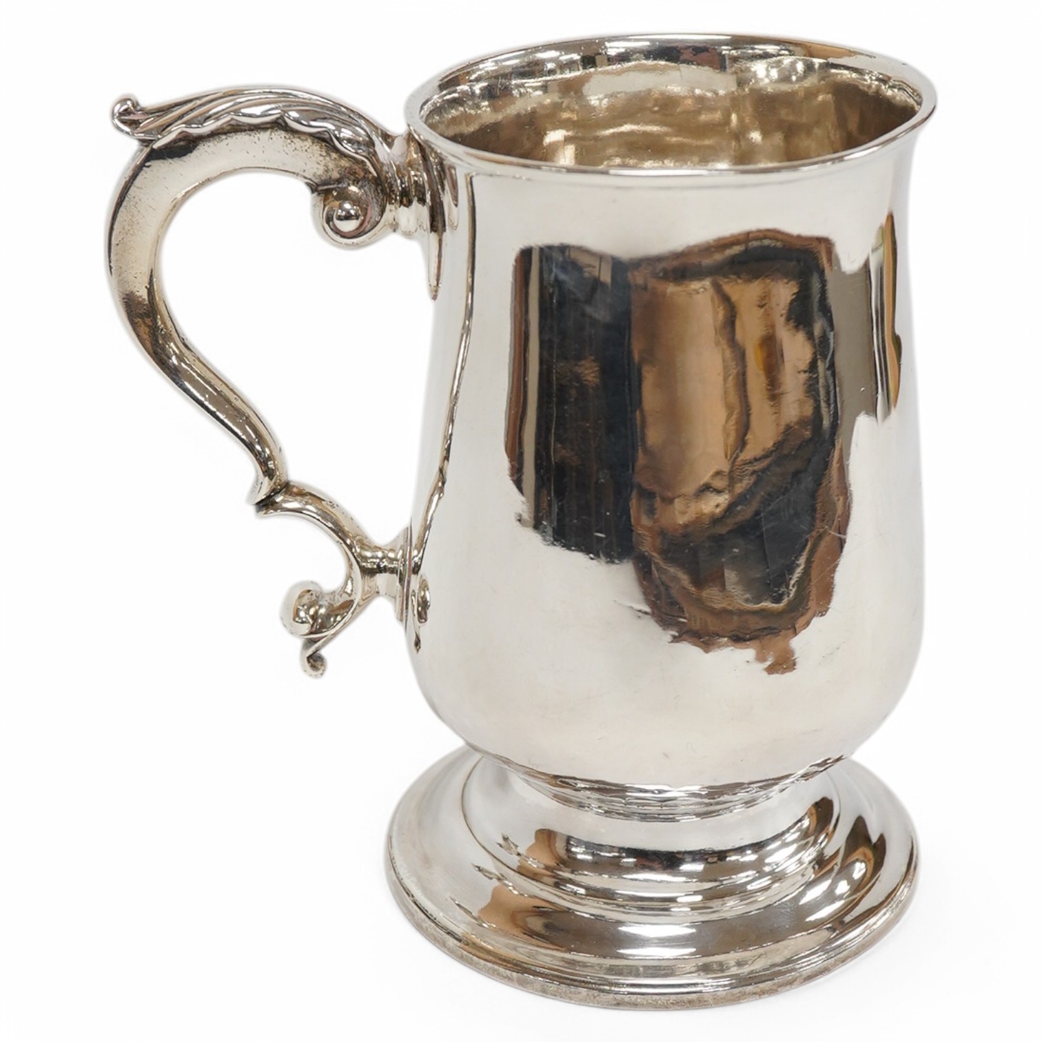 A George III silver baluster mug, with acanthus leaf capped handle, William Turton, London, 1782, height 15.5cm, 10.4oz. Condition - poor to fair